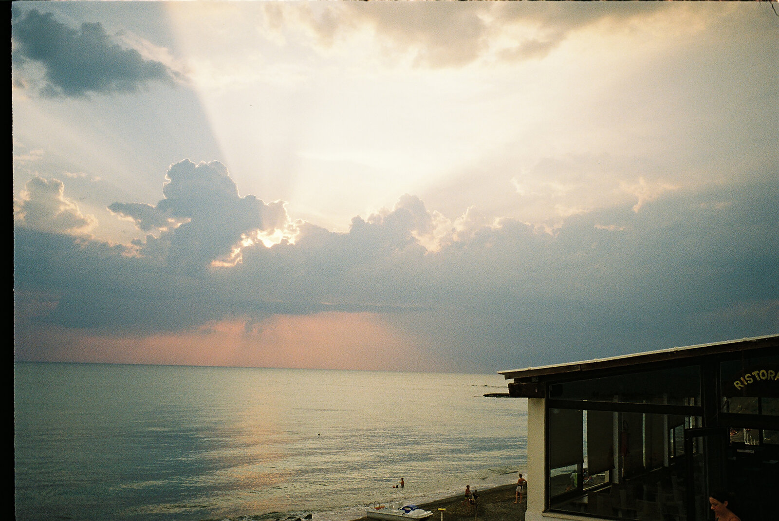 Dramatic golden clouds over the sea at sunset